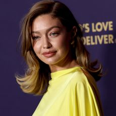 Gigi Hadid wears a yellow dress