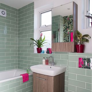 bathroom with banana leaf printed wallpapers