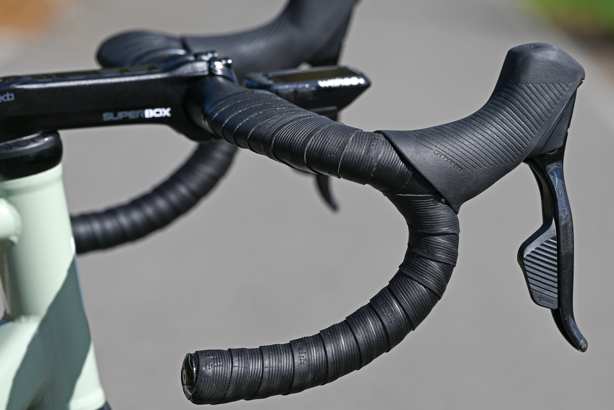 close up of the Deda handlebars and SRAM AXS Force levers