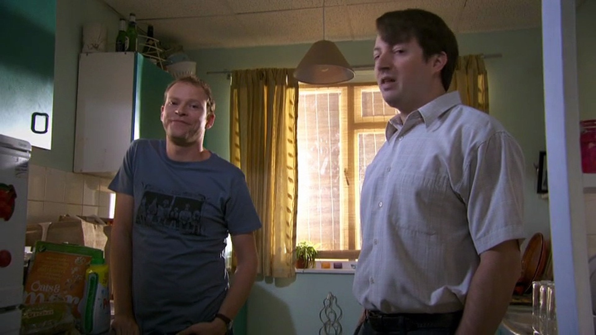 Mark and Jex stare down directly into the camera in an episode of Peep Show
