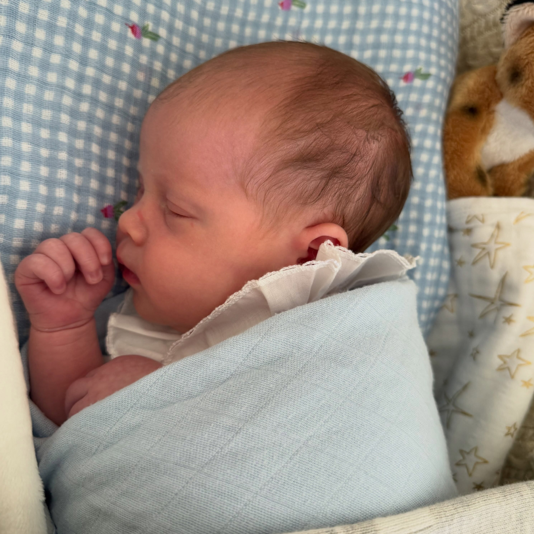 Adelaide Brooksbank wrapped in a blanket