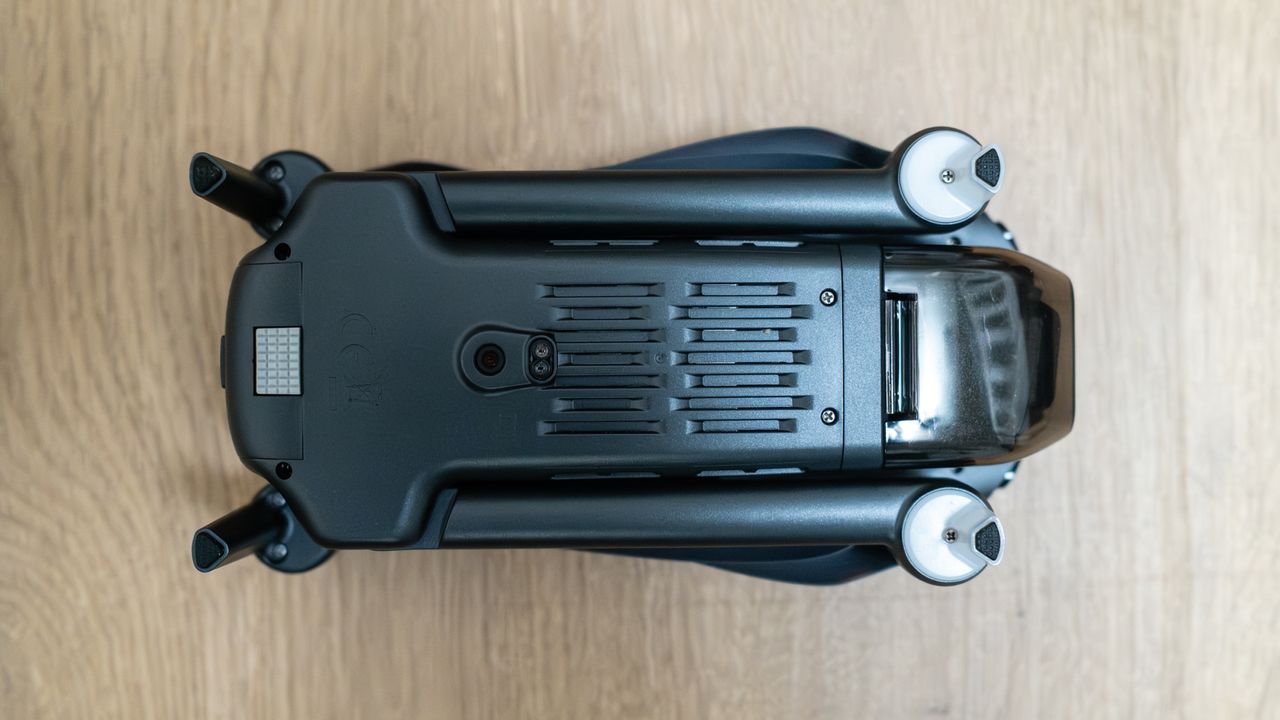 Bwine F7GIM bottom view folded on a wooden floor.