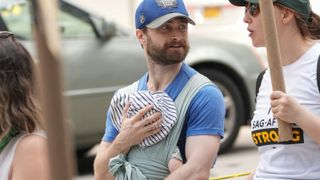 Daniel Radcliffe carrying baby