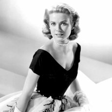 Grace Kelly wearing a black and white gown in Rear Window