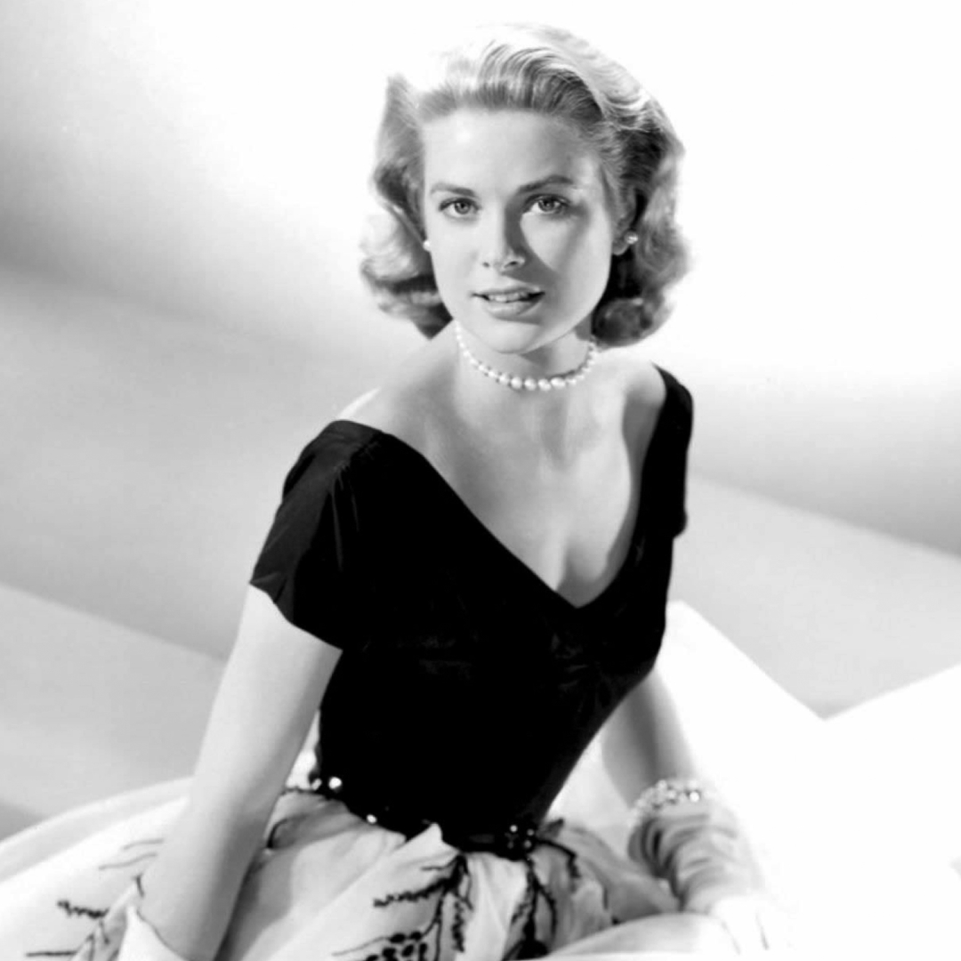 Grace Kelly wearing a black and white gown in Rear Window