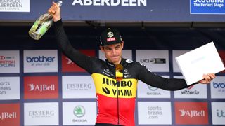 Wout van Aert collects the Tour of Britain prize