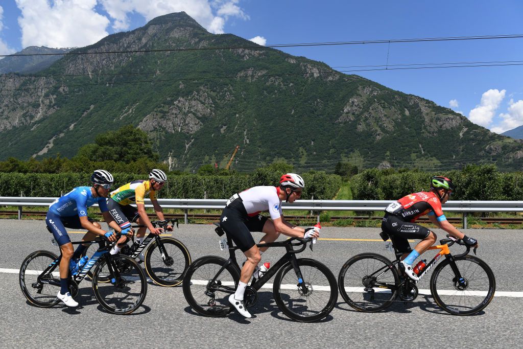 LEUKERBAD SWITZERLAND JUNE 10 Claudio Imhof of Switzerland and Team Switzerland Sergio Samitier Samitier of Spain and Movistar Team Hermann Pernsteiner of Austria and Team Bahrain Victorious Mathieu Van Der Poel of Netherlands and Team AlpecinFenix Yellow Leader Jersey in the Breakaway during the 84th Tour de Suisse 2021 Stage 5 a 1752km stage from Gstaad to Leukerbad 1385m UCIworldtour tds tourdesuisse on June 10 2021 in Leukerbad Switzerland Photo by Tim de WaeleGetty Images