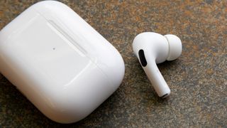 the AirPods Pro next to their charging case