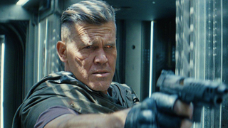 Josh Brolin pointing a gun as Cable in Deadpool 2