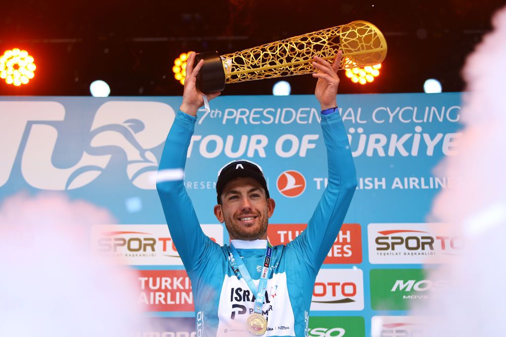 ISTANBUL TURKEY APRIL 17 Patrick Bevin of New Zealand and Team Israel Premier Tech Turquoise Leader Jersey celebrates at podium as race winner during the 57th Presidential Cycling Tour Of Turkey 2021 Stage 8 a 1378km stage from Istanbul to Istanbul Stage canceled due to slippery pavement conditions TUR2022 on April 17 2022 in Istanbul Turkey Photo by Dario BelingheriGetty Images