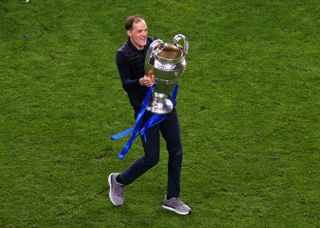 Thomas Tuchel celebrates with the Champions League trophy after Chelsea's win over Manchester City in the 2021 final in Porto.