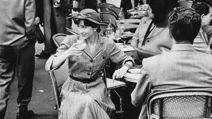 Monochrome, Hat, Photograph, Mammal, Style, Black-and-white, Chair, Monochrome photography, Crowd, Sun hat, 