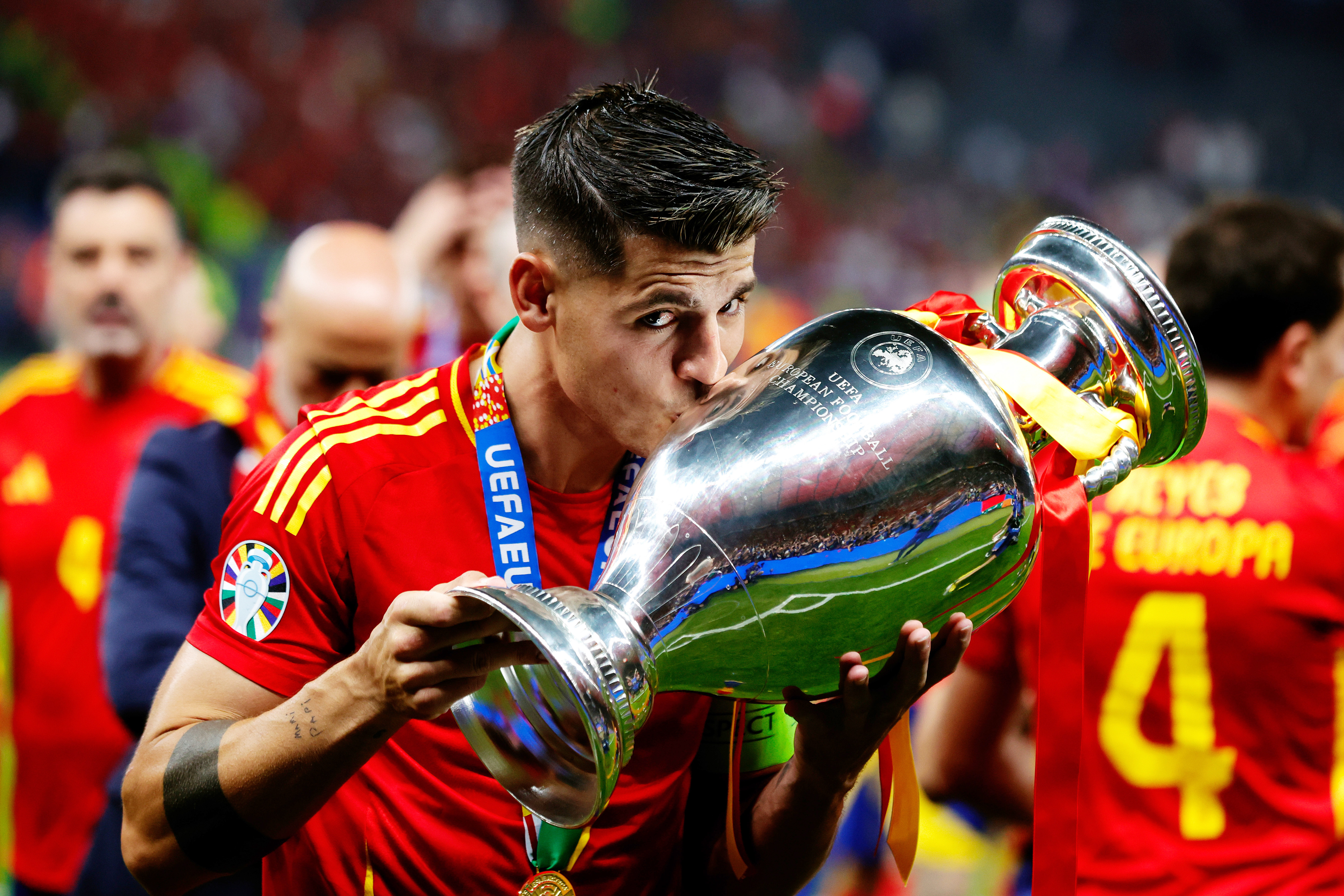 Alvaro Morata kisses the European Championship trophy after Spain's win over England in the final of Euro 2024.