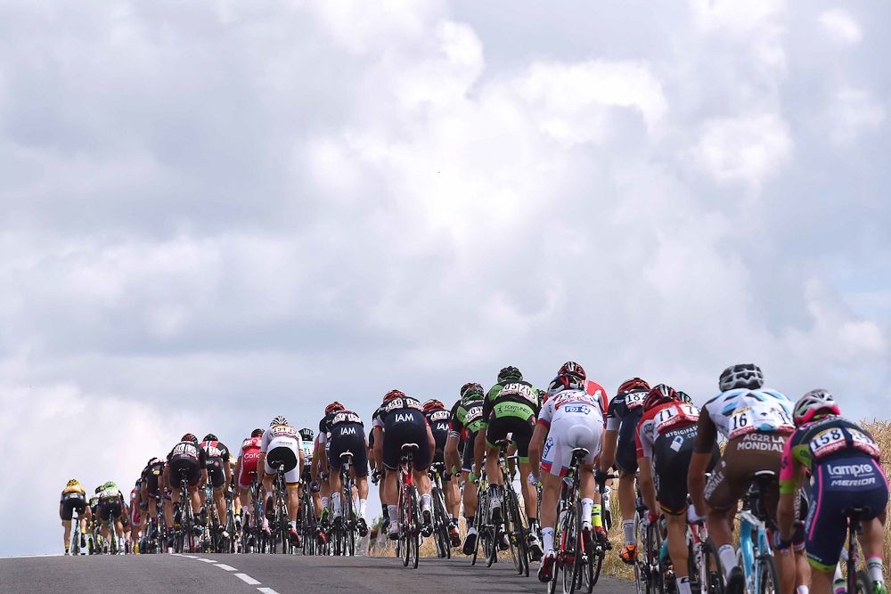The peloton rolls through the French countryside during stage 15.