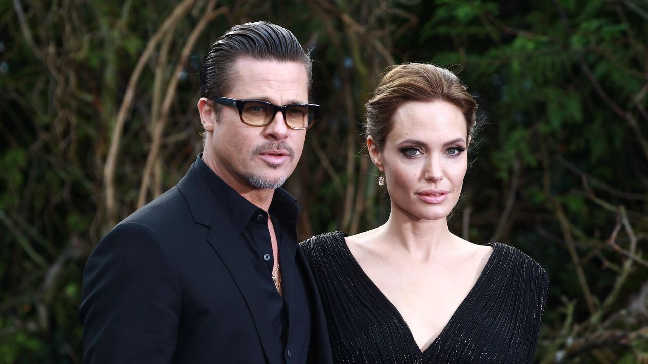 Angelina Jolie and Brad Pitt attend a private reception for &#039;Maleficent&#039; in 2014