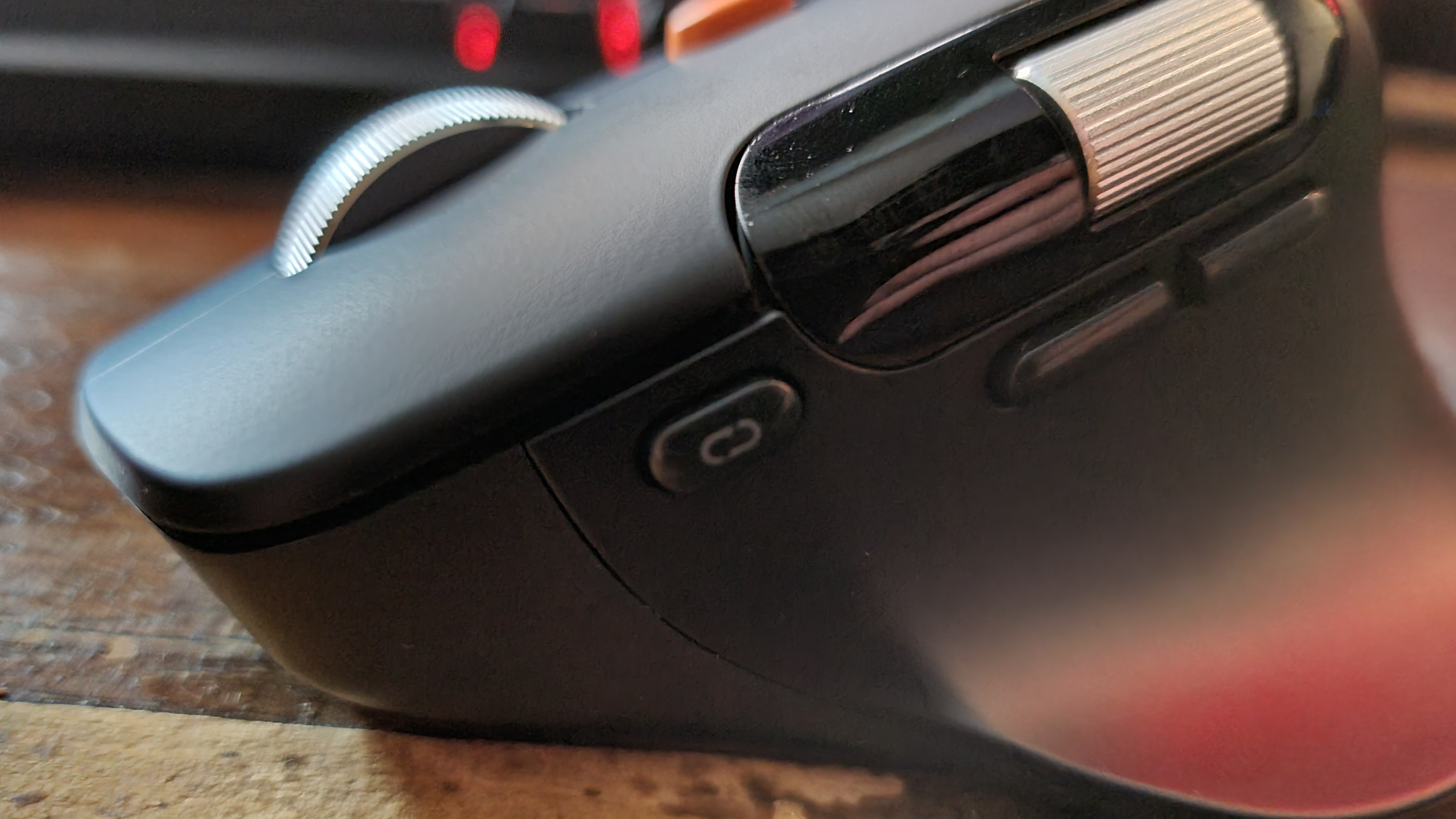 The side buttons and connection-switching button of the ProtoArc EM25 ergonomic mouse