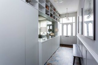hallway shoe storage ideas with white cubby holes up high