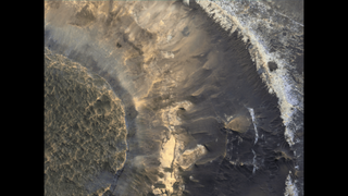 A photo of Mars landscape, with brown cracks and rock formations