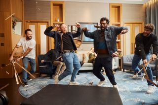 Rob and Romesh are hit with chairs while Ryan Gosling and Emily Blunt watch on shocked.