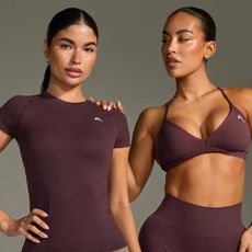 Two models wearing matching plum brown sets from Oner Active