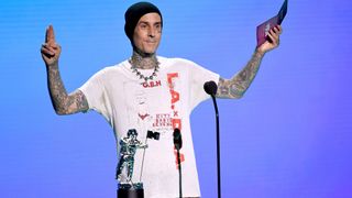Travis Barker speaks onstage during the 2020 MTV Video Music Awards, broadcast on Sunday, Aug. 30 2020.