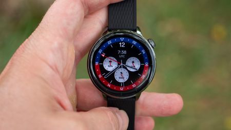 The OnePlus Watch 3 43mm with a red and blue watch face
