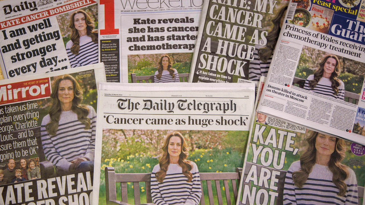 A stack of British newspaper front pages sharing the news of Kate Middleton&#039;s cancer diagnosis