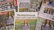 A stack of British newspaper front pages sharing the news of Kate Middleton's cancer diagnosis