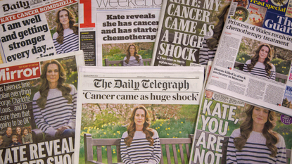 A stack of British newspaper front pages sharing the news of Kate Middleton's cancer diagnosis
