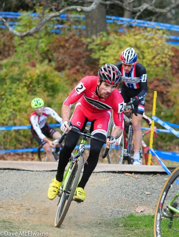 Dylan McNicholas (Cyclocrossworld.com) leading Powers at the railroad crossing