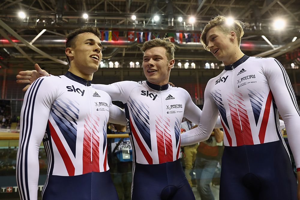 Britain's Jack Carlin (C), Ryan Owens (L) and Joe Truman celebrate after winning the men's team sprint final
