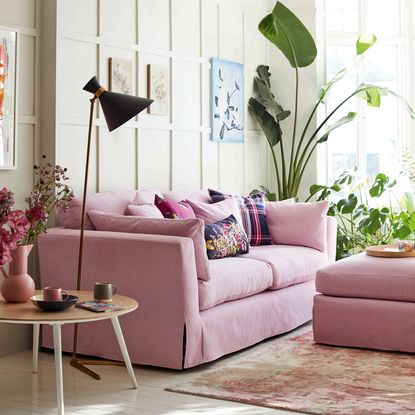 living room with pink sofa