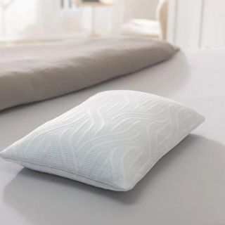 A lifestyle image of the Dreams Tempur Cloud Air SmartCool Medium Pillow pictured on a bed