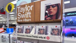 Retail store display of Taylor Swift's album Midnights in LP and CD formats