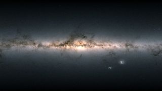 a dark glowing stretch of gases and light that is the milky way galaxy.