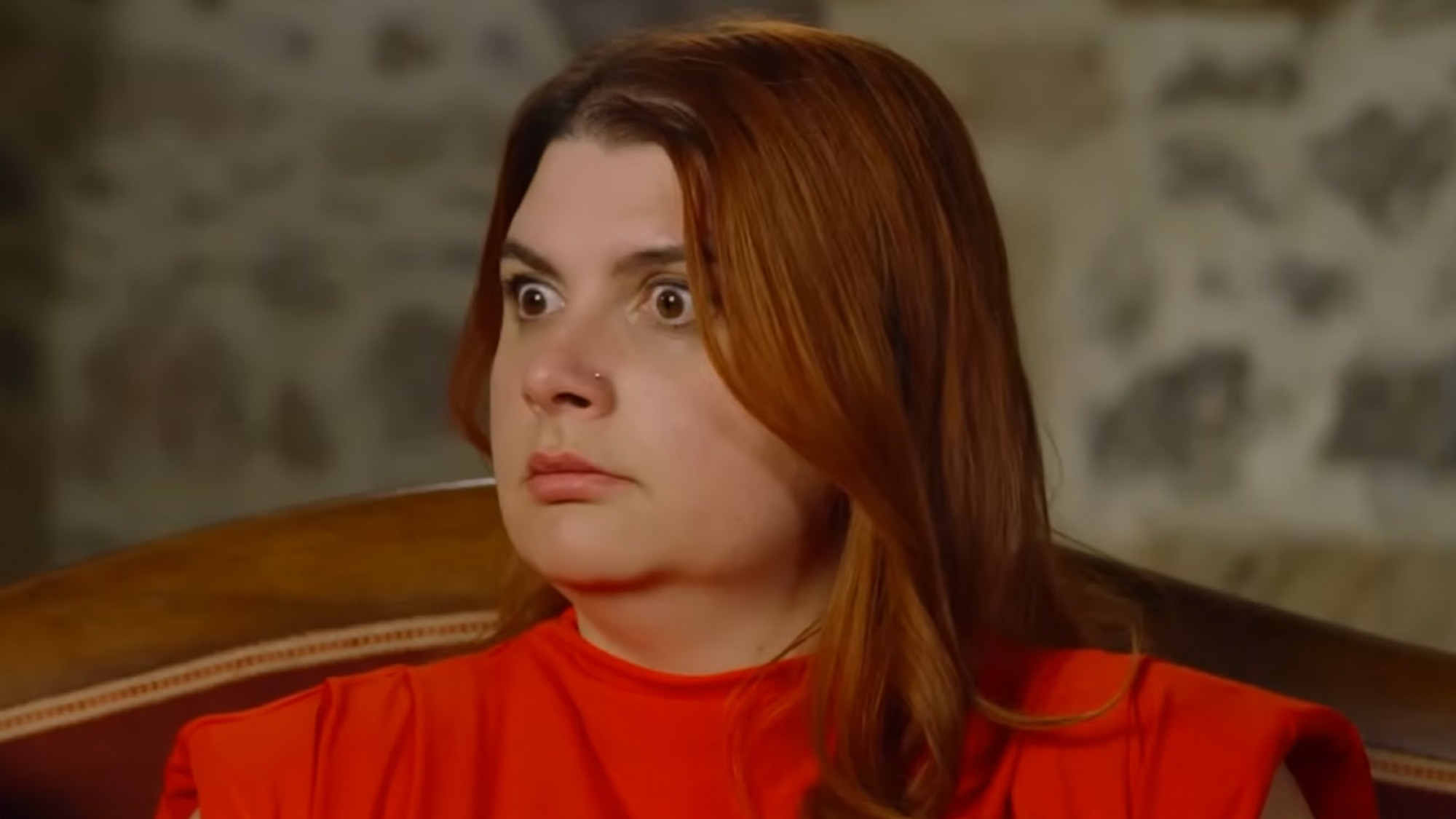 Manon with a shocked look on her face 