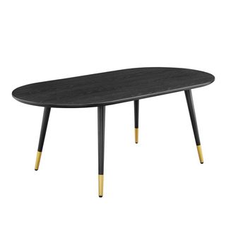 coffee table with oval shape and gold at the bottom of the legs