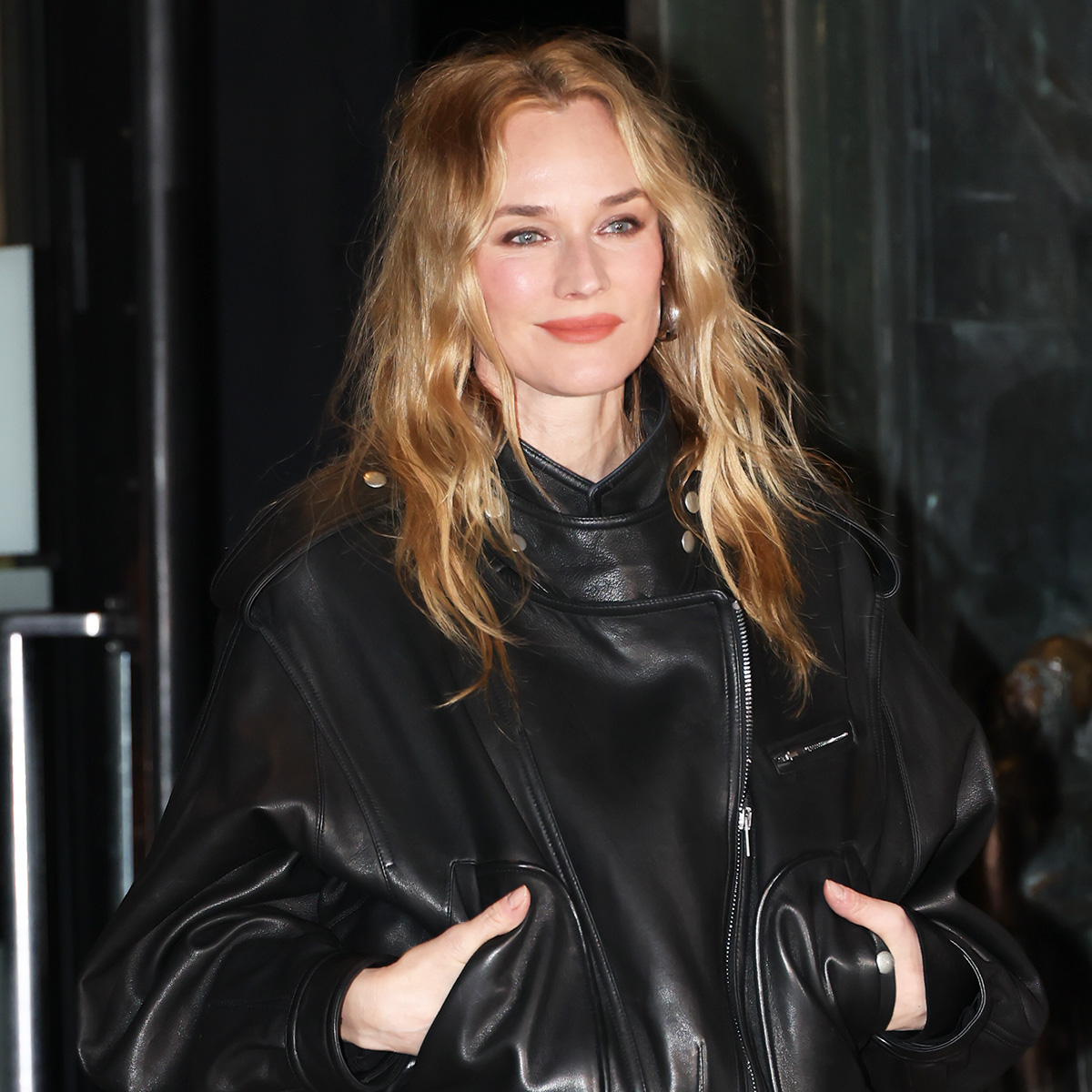 Diane Kruger wearing a leather bomber jacket in Paris