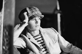 Brigitte Bardot relaxing wearing a man's cap