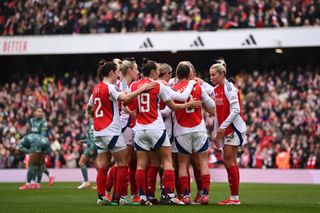 Mariona Caldentey of Arsenal celebrates with teammates after scoring her team's second goal during the Barclays Women's Super League match between Arsenal and Tottenham Hotspur at Emirates Stadium on February 16, 2025 in London, England.