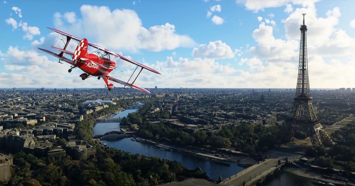 A plane flies past the Eiffel Tower