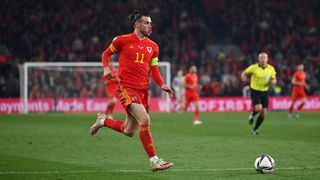Gareth Bale playing football for Wales