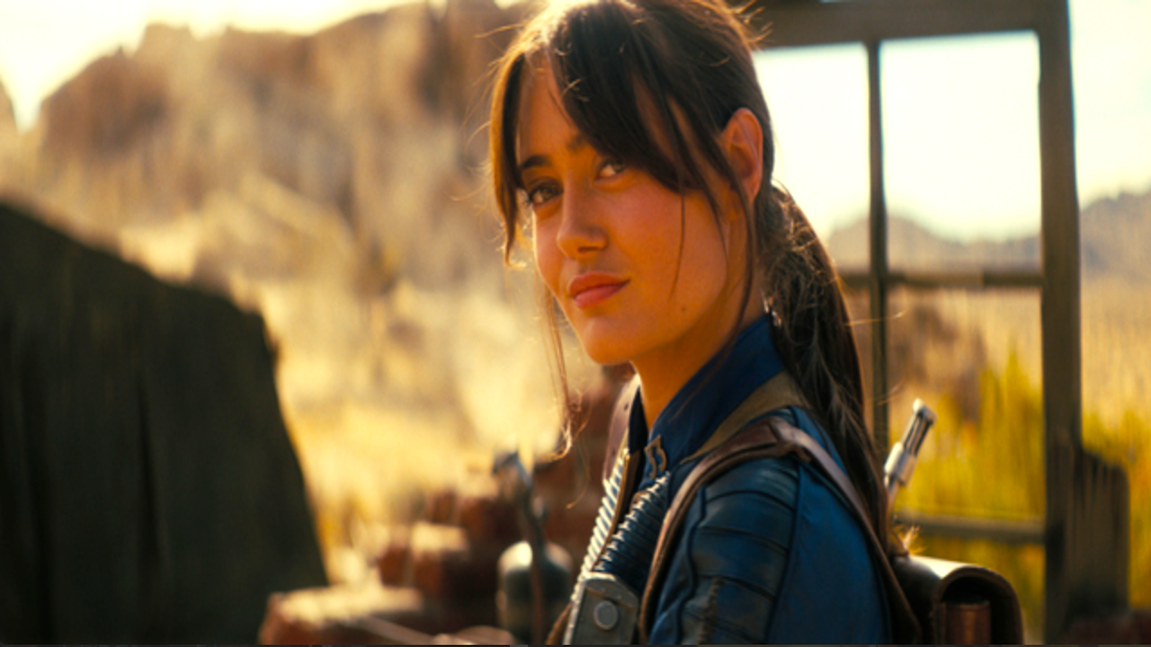 a girl in a blue jumpsuit in a desert environment