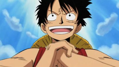A close-up of Luffy holding his fist during the anime One Piece. 