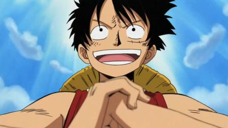 A close-up of Luffy holding his fist during the anime One Piece. 