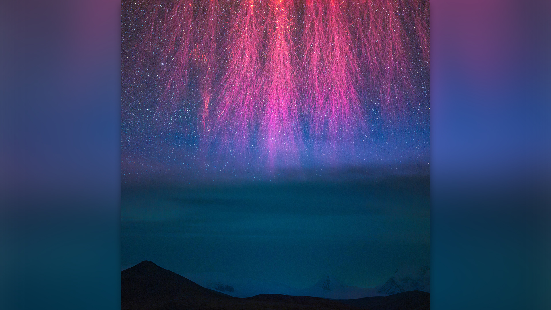 Pink sprite flashes over the Himalayan mountains.