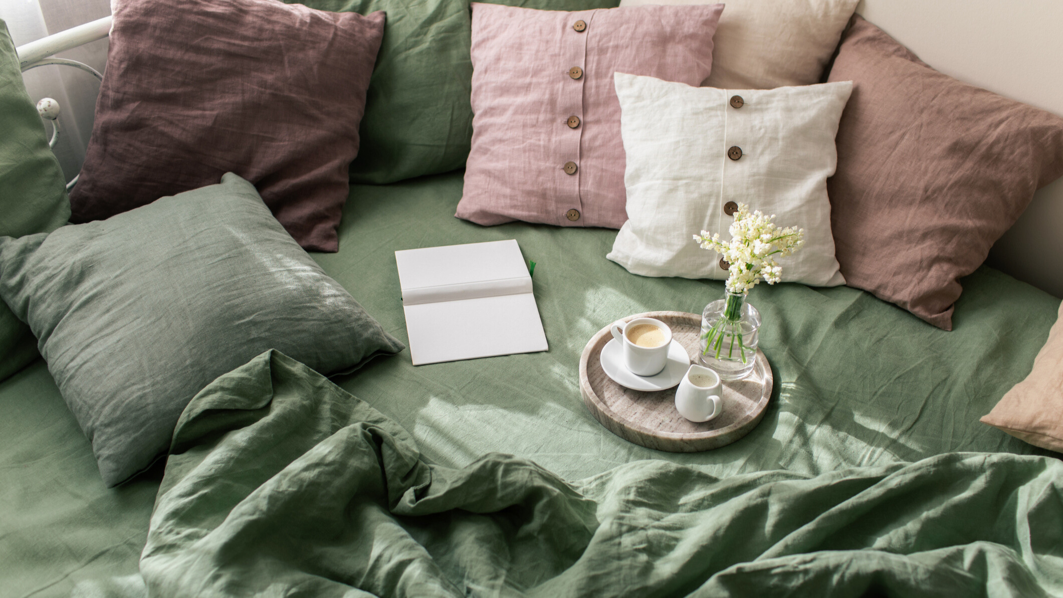 Green and pastel coloured bedding 