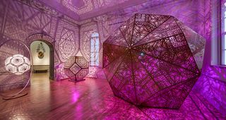 Purple and pink lit up art installation at the Renwick Gallery called Heart of Gold, 2016, by HYBYCOZO
