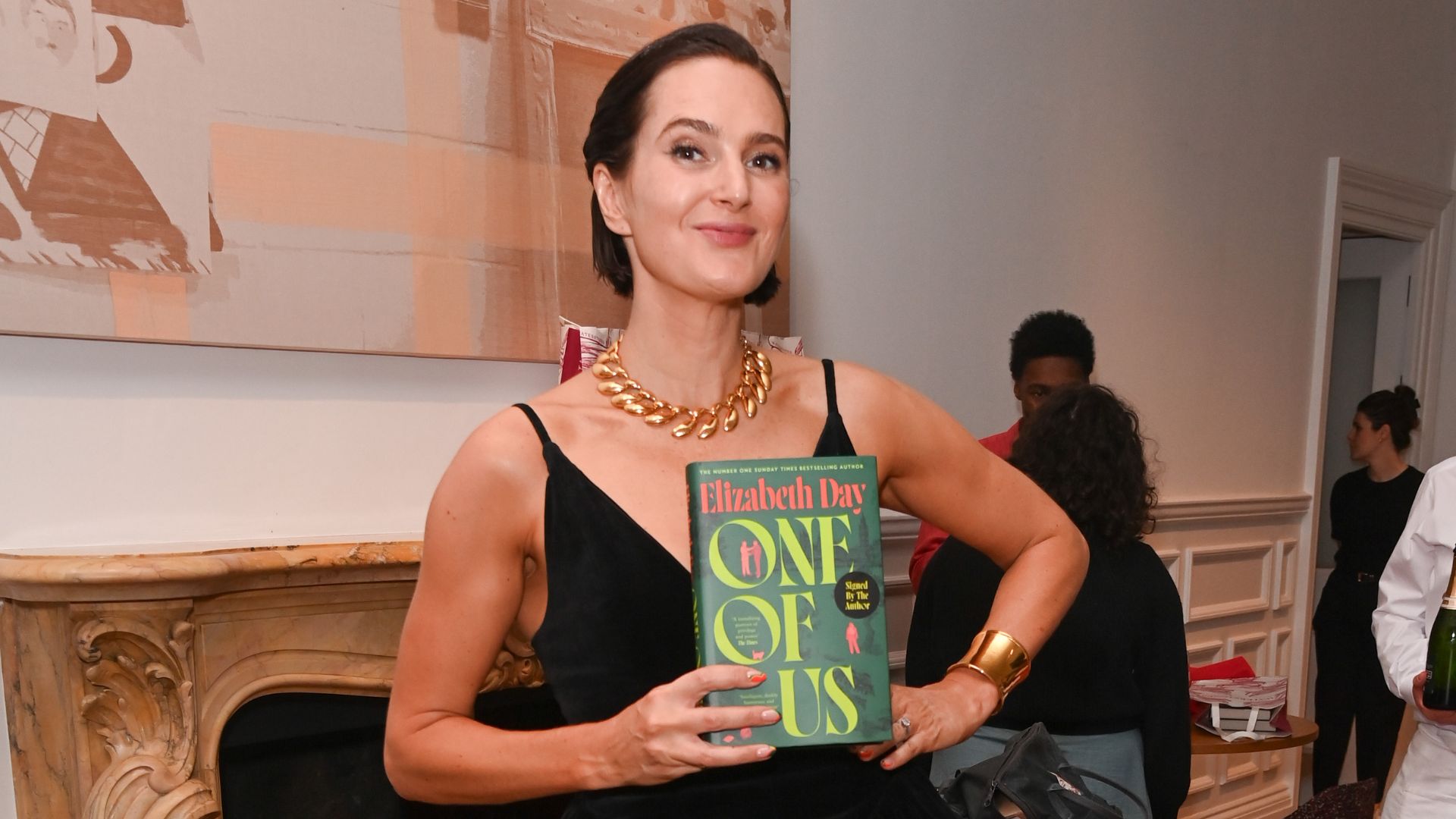 Elizabeth Day holding new book, One of Us