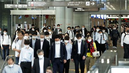Commuters at Nagoya railway station last week